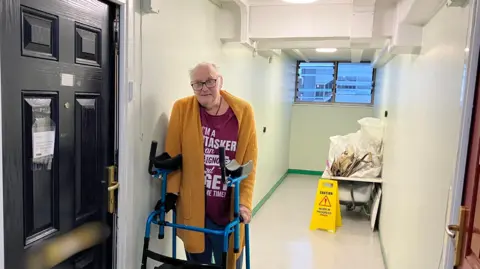 Man stood in hallway