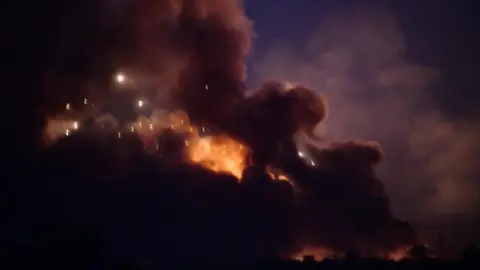 EPA Explosion at Popular Mobilisation arms depot near Baghdad, Iraq, on 12 August 2019