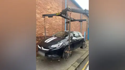 Middlesbrough Council Car being picked up by crane