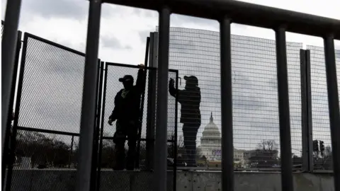 EPA Workers assemble barricades around the US Capitol
