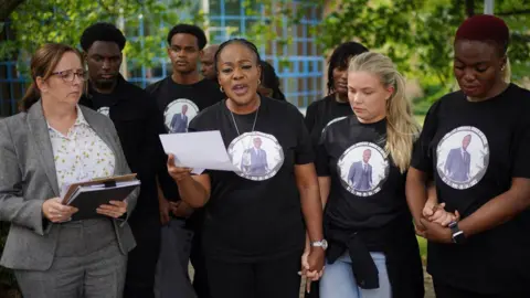 PA Media Michael Ugwa's family at Basildon Crown Court