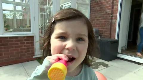 Annabel blowing bubbles