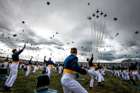 Michael Ciaglo / Getty Images Air Force Academy cadets celebrate their graduation