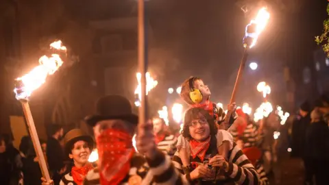 Getty Images/Peter Summers Bonfire societies parade through the streets during traditional Bonfire Night celebrations
