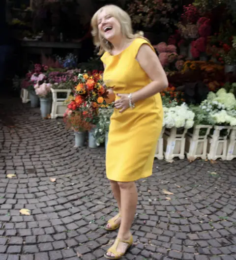 Sue Elliott-Nicholls Picking up the flowers