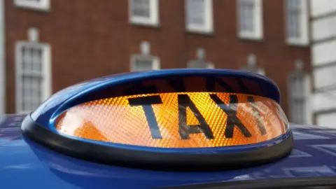 Getty Images Taxi sign