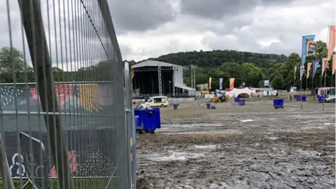 Kat Cowan/BBC The muddy site at Hillsborough Park following the three-day festival