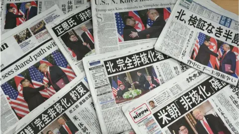 Getty Images Newspapers showcasing the landmark US-North Korea summit between Donald Trump and Kim Jong Un