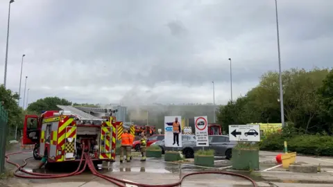 Chris Arundel/BBC Fire crews are tackling the blaze