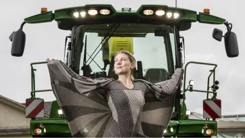 Danny Lawson / PA Lizzie McLaughlin models a design made from British wool