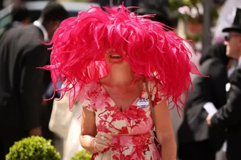 Reuters A racegoer is seen during ladies day at Royal Ascot