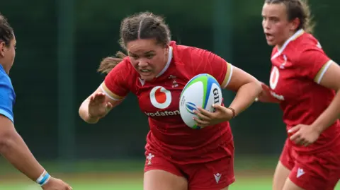 Jorja Aiono of Wales charges forward