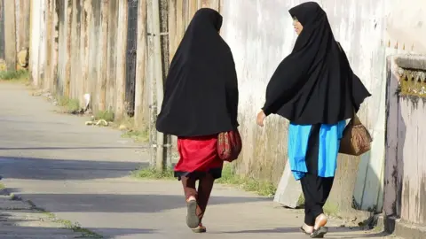 AFP In this picture taken on April 25, 2019, Sri Lankan Muslim girls walk along a road in Kattankudy