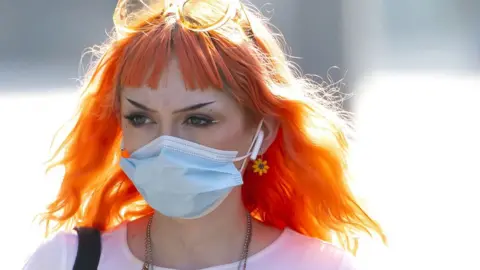 Getty Images Woman in face mask