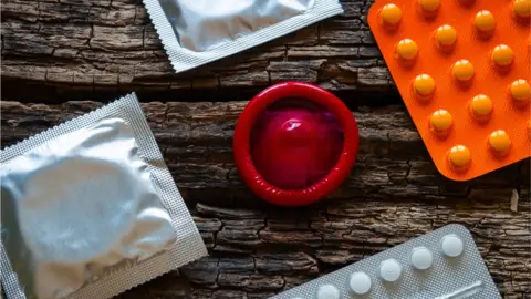 Getty Images Condoms and the contraceptive pill