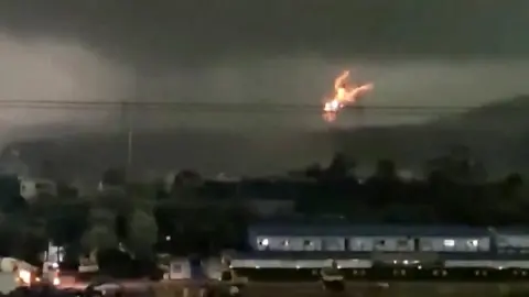 Fire erupts arsenic  tornado hits powerfulness  lines
