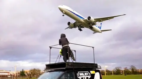 Jerry Dyer on top of the Big Jet TV van