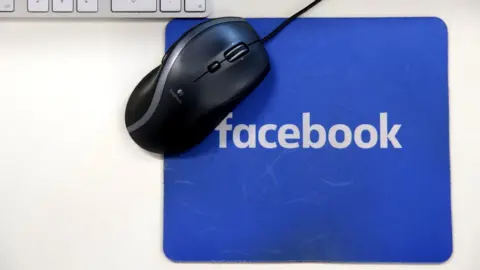 AFP A computer mouse on a Facebook mousemat