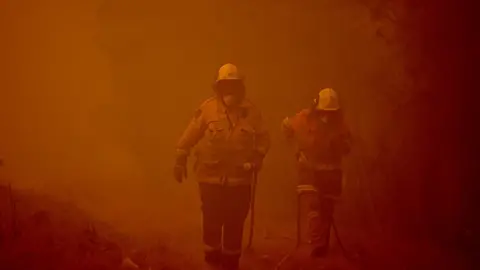 Getty Images Firefighters tackle blazes in New South Wales