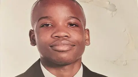 Family handout Osime Brown in a school portrait