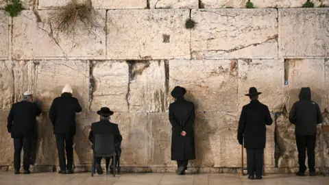 EPA Jews pray at the Western Wall in Jerusalem (22 January 2020)