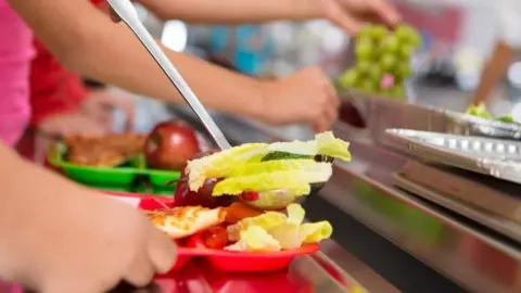 Getty Images School meals being dished out