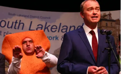 Getty Images Mr Fish Finger and Tim Farron