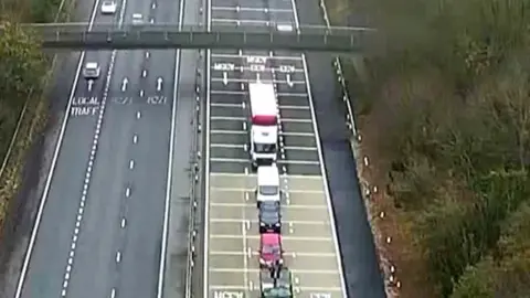 Lorry crashes into stationary traffic