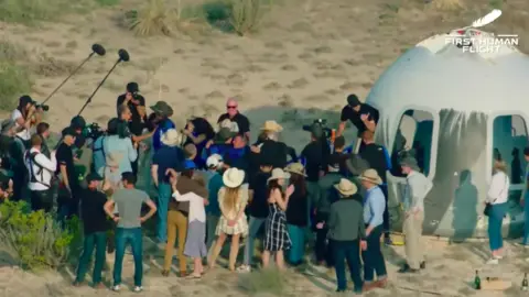 Blue Origin Crowd around New Shepard capsule