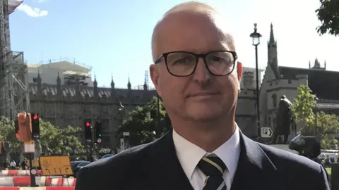 Al White in front of Parliament