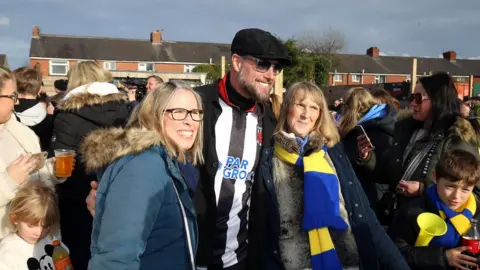 PA Media Keith Duffy of Boyzone with Chorley fans ahead of the Isuzu FA Trophy fifth round match at Victory Park