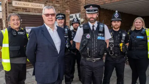 Al Underwood Roger Hirst and Andy Prophet with Essex Police staff