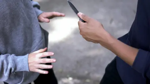 Getty Images A teenager with a knife