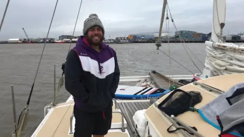 Ross Edgley Ross Edgley on a boat in Grimsby