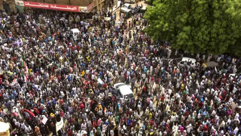 Getty Images Sudanese protesters march in a mass demonstration against the country's ruling generals in the capital Khartoum's twin city of Omdurman on June 30, 2019.