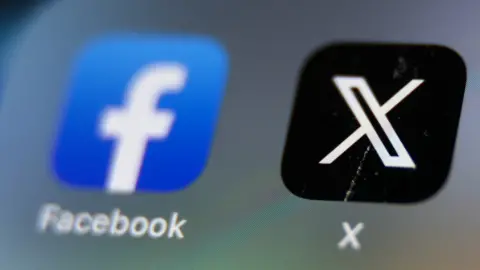 Getty Images A phone screen showing icons for the Facebook and X apps