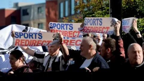 Getty Images Newcastle United fans protest against Mike Ashley