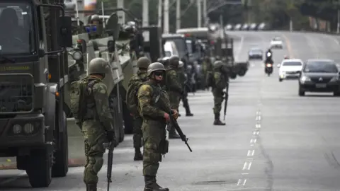 AFP Brazilian marines deploy during a pre-dawn anti-gang operation in Niteroi, greater Rio de Janeiro, Brazil, on August 16, 2017