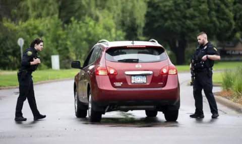 Getty Images Police ask a driver some questions