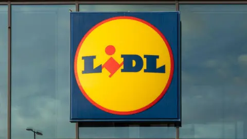 A general view picture of a yellow, blue and red Lidl sign.