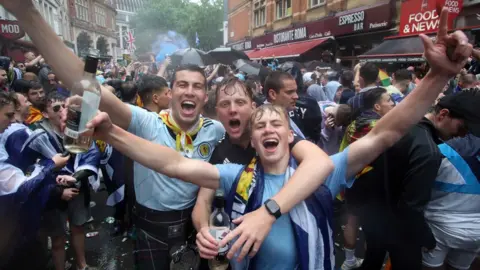 PA Media fans in Leicester Square on Friday
