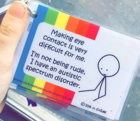 Abby Cappleman A card which reads: 'Making eye contact is very difficult for me. I'm not being rude, I have an autistic spectrum disorder.'