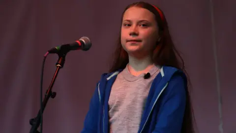 Getty Images Greta Thunberg speaks to protesters gathered at Marble Arch as the Extinction Rebellion protests in London