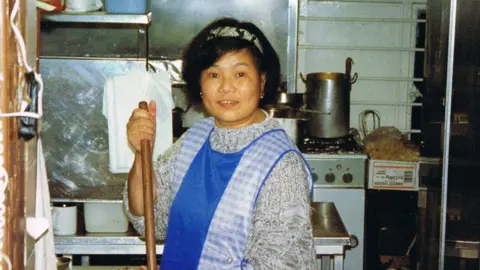 Angela Hui Angela's mum working in the takeaway