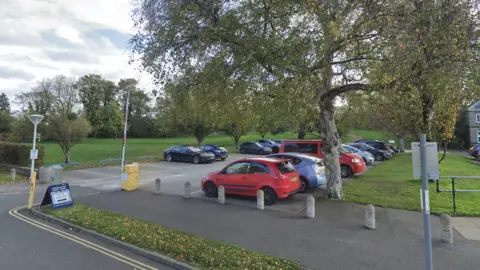 Google  The Castle Court car park with a pay and display sign