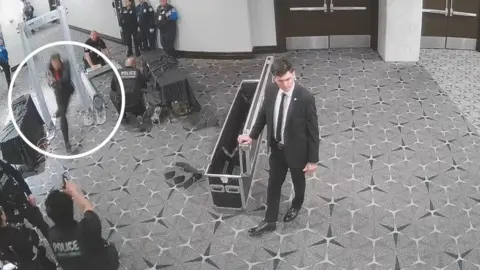 CCTV footage showing the WHCD suspect taking aim at a secret service member. 