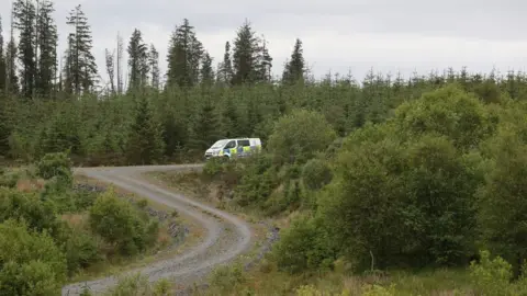 PA Media Police at the scene where the body was found