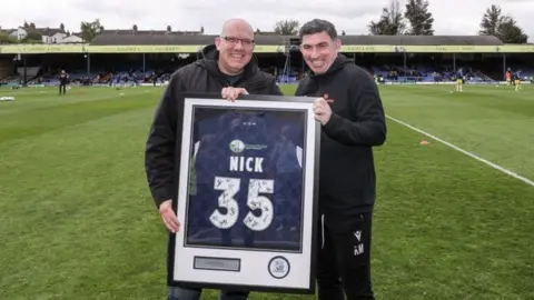 Southend United Nick Alliker is presented with a special shirt