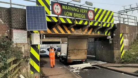 Cambs Police Van stuck under bridge