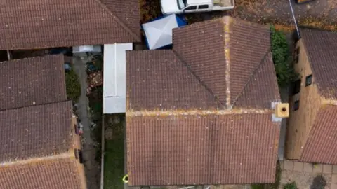 PA Media Aerial view of house being searched in Leah Croucher case